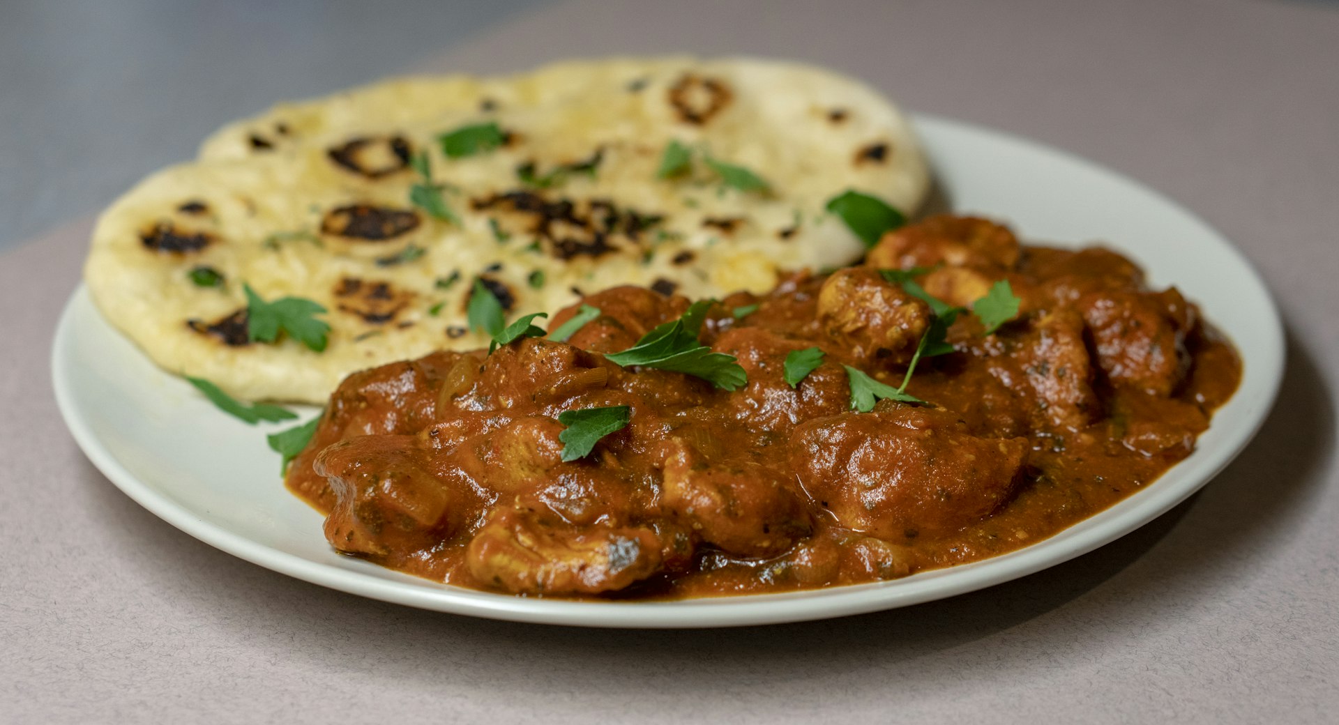 Naan pulled from the glowing tandoor